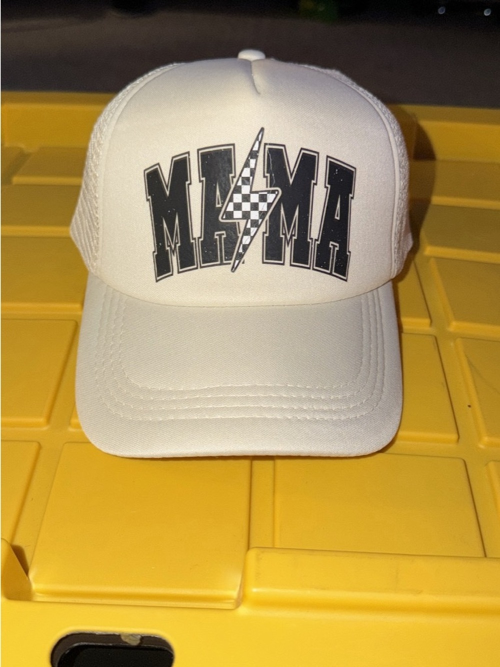 White Trucker Hat with Black "MAMA" Logo and Lightning Graphic